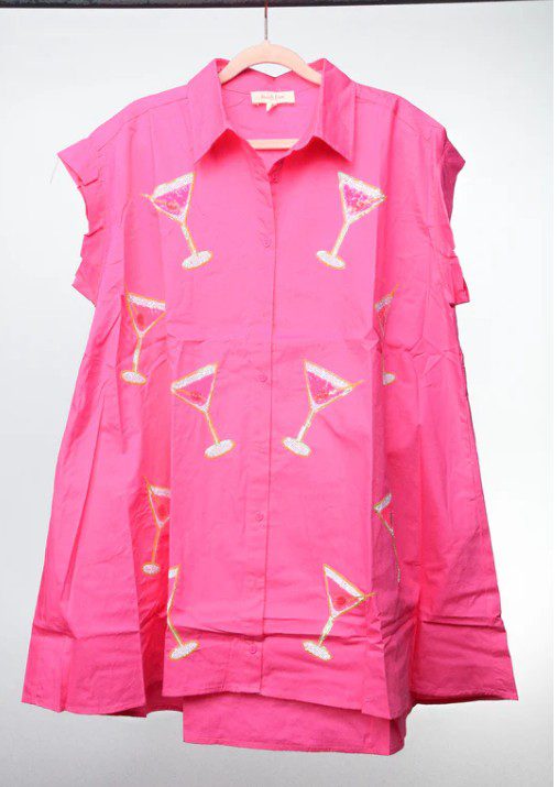 Bright pink shirt adorned with white cocktail glass prints.