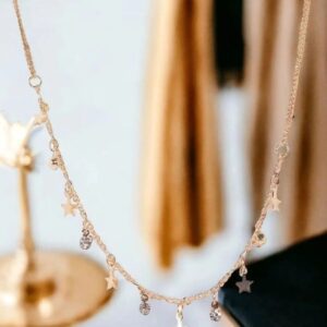 Elegant gold necklace with sparkling gemstones draped gracefully.