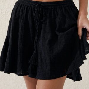 Black casual skirt with a pocket detail, worn by a person.