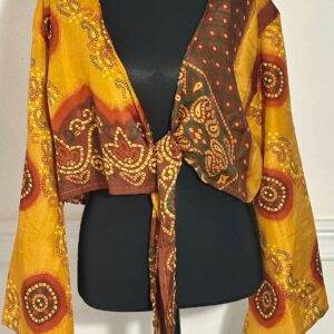 Bohemian-style tie-front blouse with bell sleeves and paisley print.