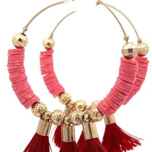 Pair of stylish hoop earrings with pink discs and red tassels.