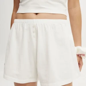 White casual shorts with an elastic waistband.