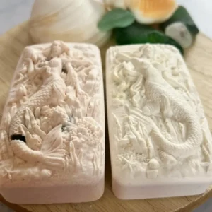 Intricately carved soap bars featuring detailed animal designs.